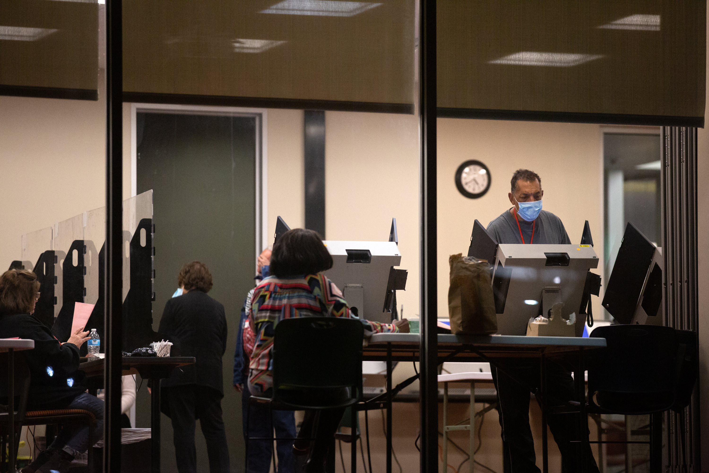 Voters cast their ballots at the Lochwood Branch Library in Dallas on Feb. 25, 2022, the last day of early voting in the Texas primary. Dallas County voting centers’ hours were extended <a href=