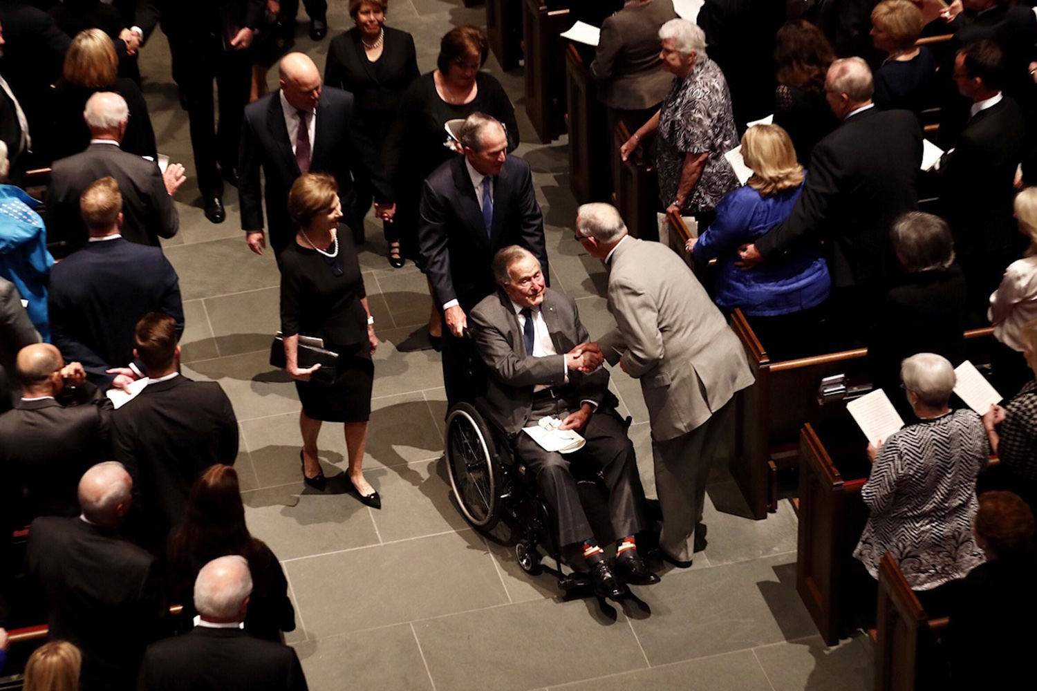 Former President George H.W. Bush accepts condolences as he leaves St. Martin's Episcopal Church after the funeral service for his wife Barbara, in Houston on April 21, 2018. The former first lady will be interred in College Station. 