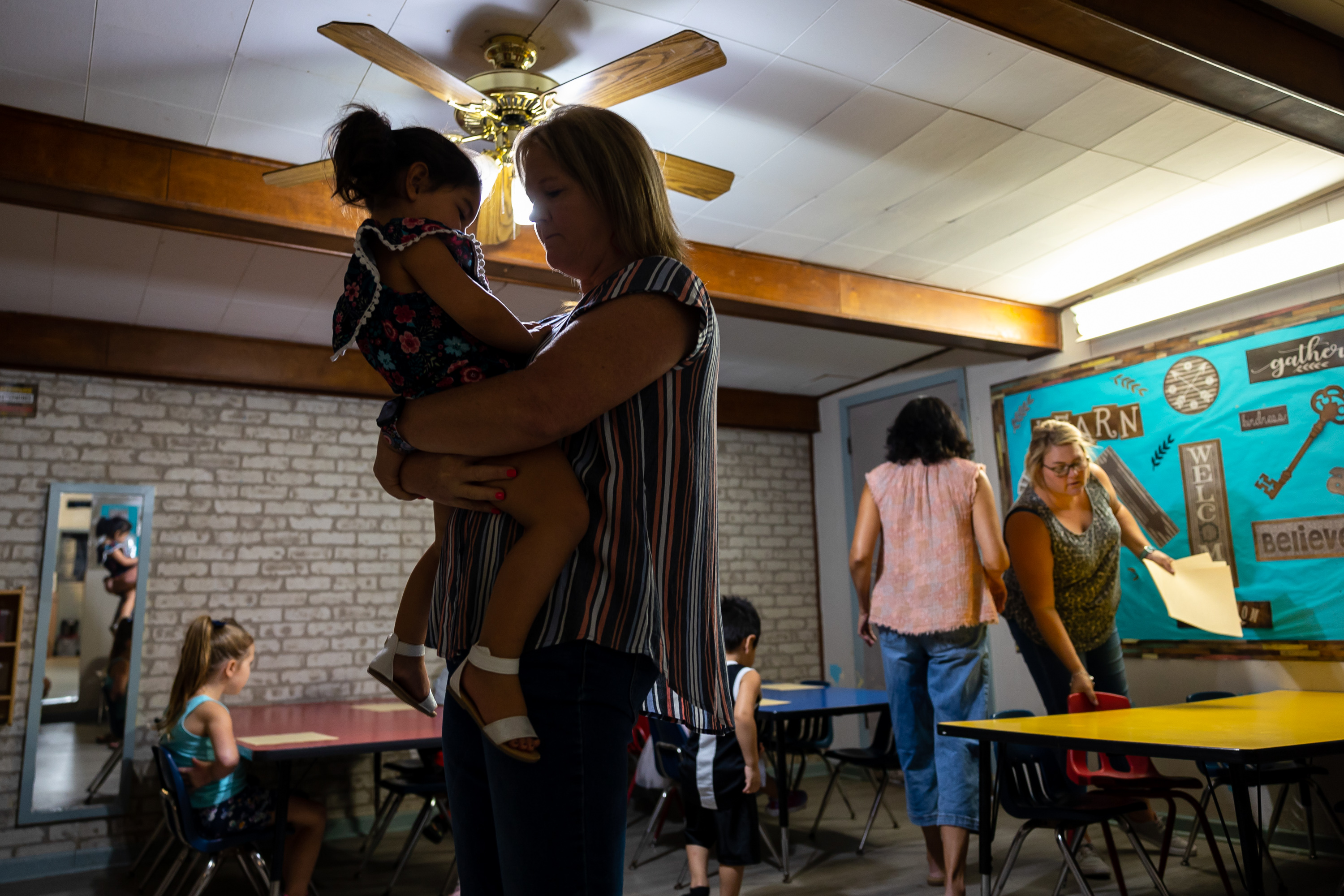 Learning Tree owner Christa Marek holds her granddaughter at the Learning Tree childcare center in Yoakum, on Sept. 13, 2022.