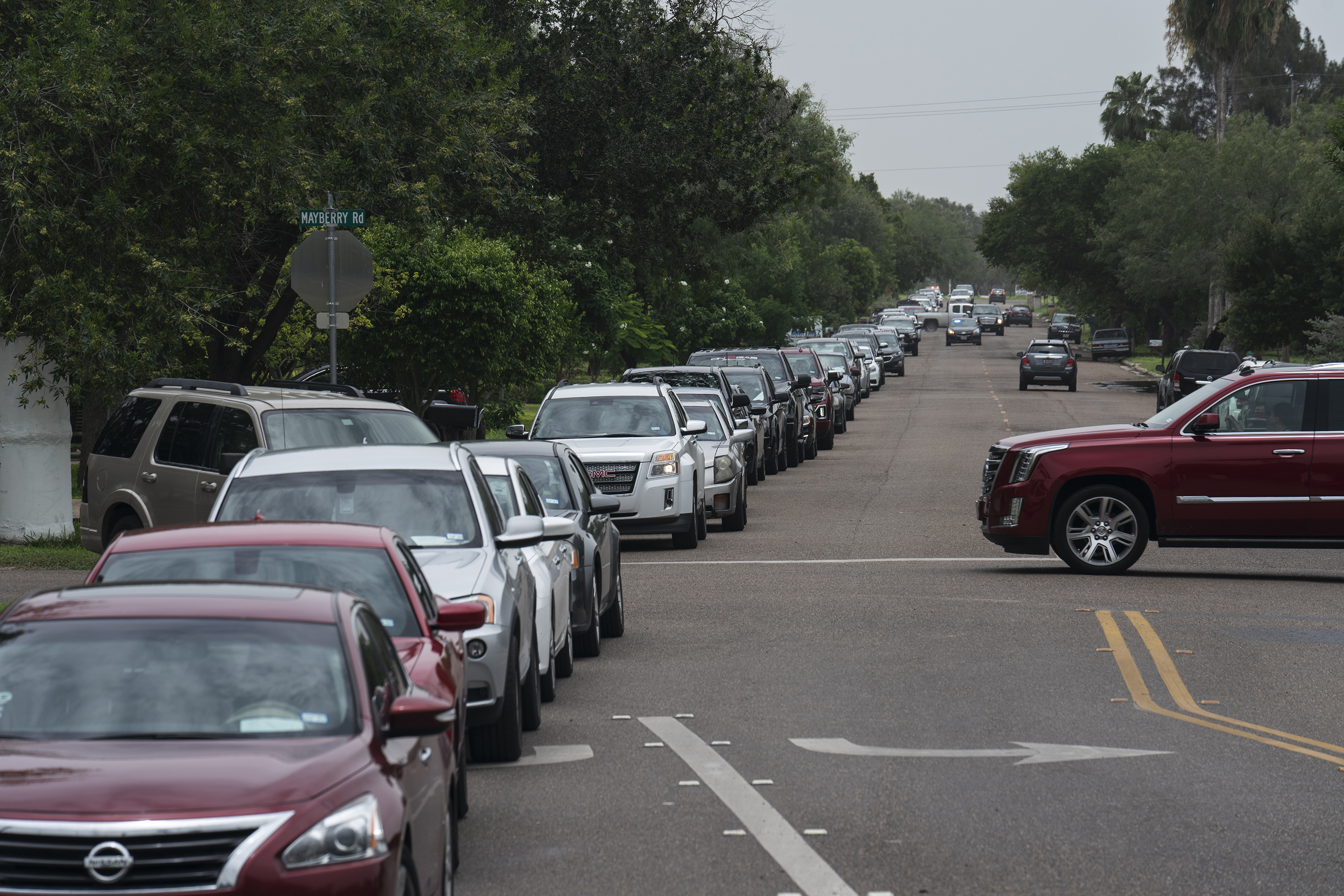 People wait in their vehicles to get tested for COVID-19 at a temporary testing site in Mission on June 26, 2020.