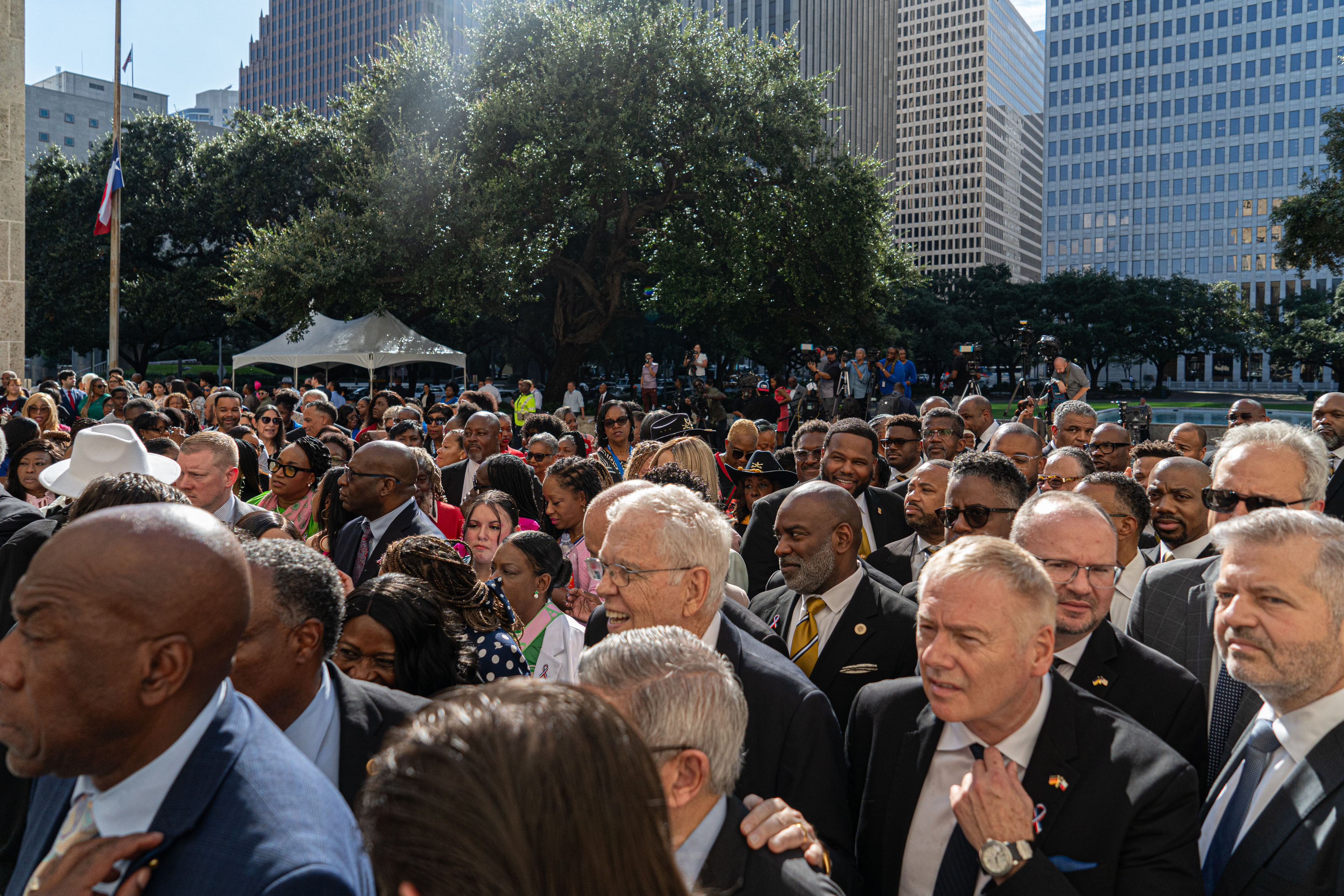 People listen to Houston Mayor John Whitmire in the courtyard of City Hall before being allowed to enter the building to their respects to the late congresswoman Sheila Jackson Lee as she lies in state, Monday, July 29, 2024, in Houston.