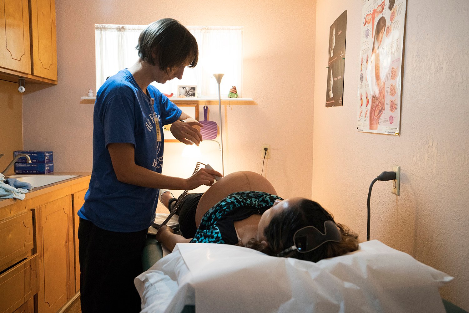 Vanna Waldron (left) evaluates Erika Piñon at the Holy Family Birthing Center in Weslaco, Texas. Waldron is a Certified Nurse Midwife from Seattle, Washington, who is volunteering at the birthing center for a year.