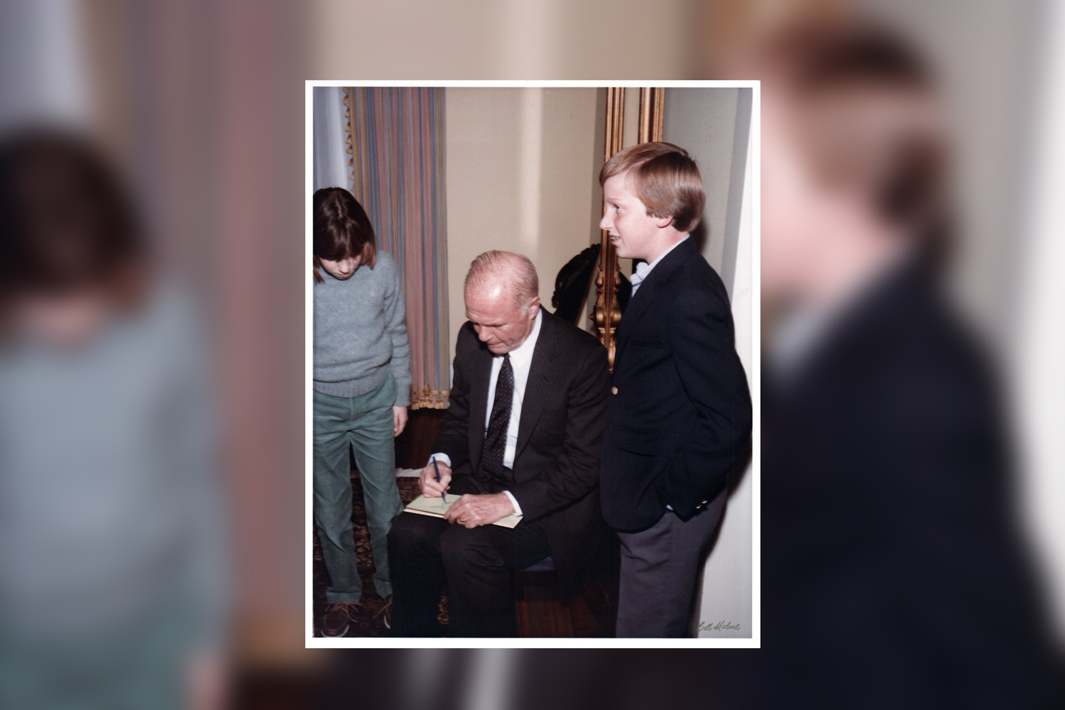 Andrew White, the son of former Gov. Mark White, is pictured at the Texas Governor's Mansion in 1979, waiting for astronaut John Glenn's signature.