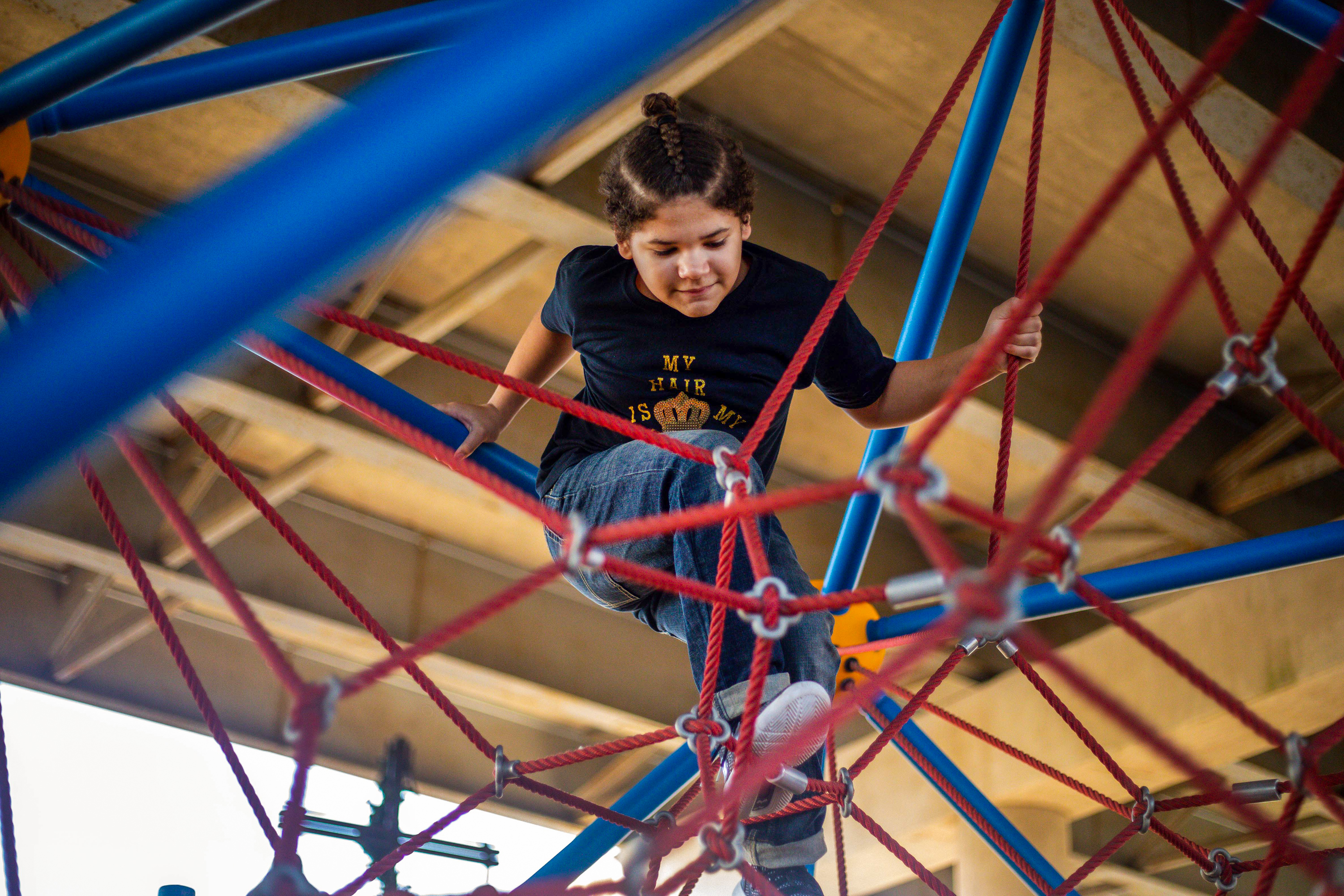 Maddox Cozart, 12, plays at a park in Temple on Dec. 8, 2021. Maddox was placed in in-school suspension over his hairstyle earlier this year.