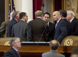 House members huddle at dais on February 14th, 2013