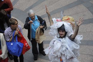 An environmentalist dressed as a "bag monster" protests HB 2416 on March 20, 2013 by State Rep. Drew Springer, R-Muenster, banning local bag ordinances.