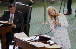 Sen. Wendy Davis, D-Ft. Worth, stretches while answering questions during her abortion bill filibuster on June 25, 2013.