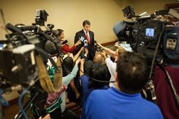 Governor Perry answers press questions after his speech at the National Rights for Life convention in Dallas.