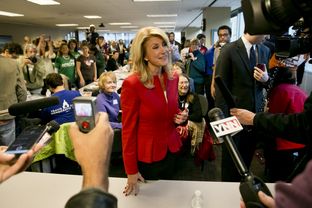 Democratic candidate for Governor of Texas, Sen. Wendy Davis, speaks to press after meeting with volunteers at a phone bank in Austin, Texas