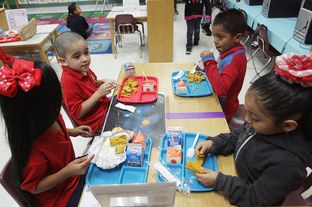 School children at Cantu Elementary in San Juan, Texas, eat their free breakfast, Wednesday April 24, 2013.