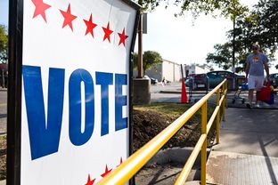 Vote signs outside of early voting locations in Austin on Feb. 23, 2014.