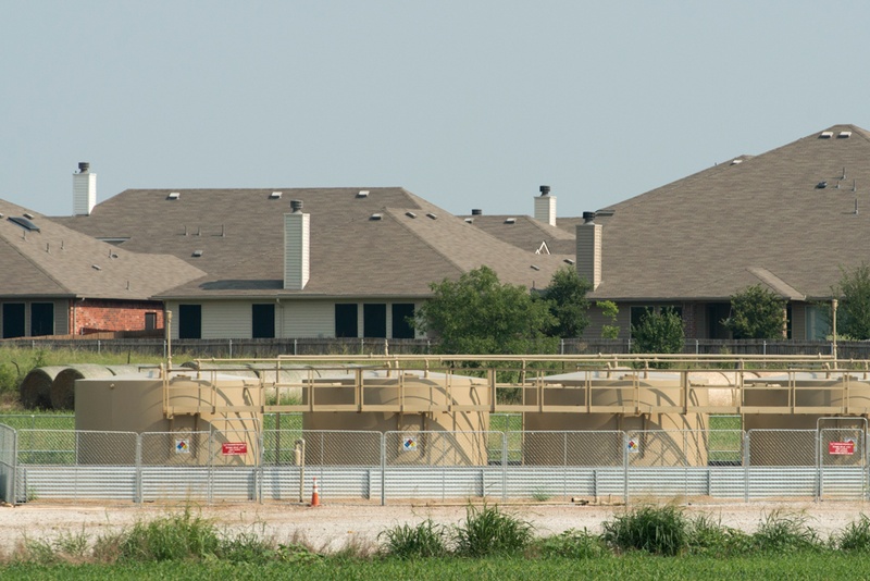 A gas well is shown in 2014 sitting less than 400 feet from a home in Denton.