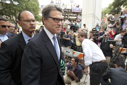 Gov. Rick Perry leaves the Blackwell-Thurman Justice Center in Austin after his booking on Aug. 19, 2014.