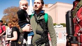 Chris Way and his son Ryan, 2, participate in an open carry march on March 12, 2014 during the South by Southwest festival. The event was led by the Austin chapter of Come and Take It.