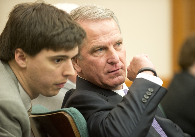 Health and Human Services Executive Commissioner Kyle Janek whispers to an aide at a hearing of the Sunset Advisory Commission on Jan. 14, 2015.