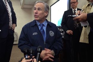 Gov. Greg Abbott speaks to reporters at the Security Operations Center at the Department of Public Safety on May 12, 2015.