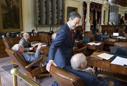 House Speaker Joe Straus, R-San Antonio, takes a break from the chair to speak with members during floor debate on May 27, 2015.