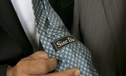 State Sen. José Menéndez, D-San Antonio, shows off his Sine Die tie on the last day of the 84th Legislative session on June 1, 2015.