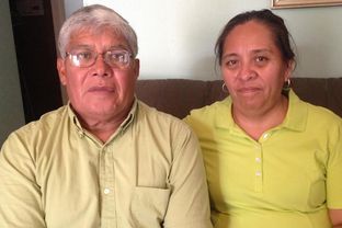 Isidro Almendarez sits next to his wife Irma in their Lockhart home. The former construction worker struggled to make sure his employer documented a hand injury and fought a serious infection as a result.