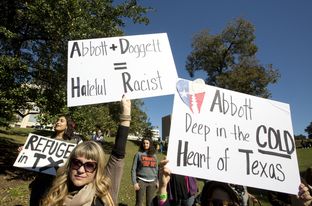 rally at Wooldridge park in Austin to protest Gov. Abbott's decision on Syrian refugees