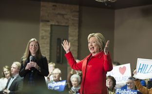 Hillary Clinton cheers as she acknowledges the crowd in Carroll, Iowa with daughter Chelsea on Jan. 30, 2016.