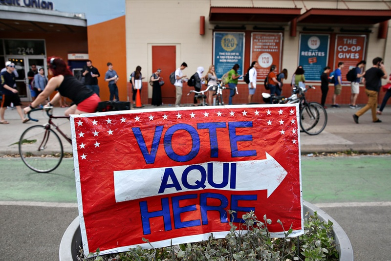 Voters wait in line at the University of Texas Co-op to cast their ballots in the March 1, 2016 primary elections.