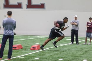 Texas A&M football team runs drills during the spring practice on March 3, 2015.