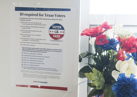 A copy of the new voter ID regulations is posted at a south Texas early voting location on October 26, 2016.