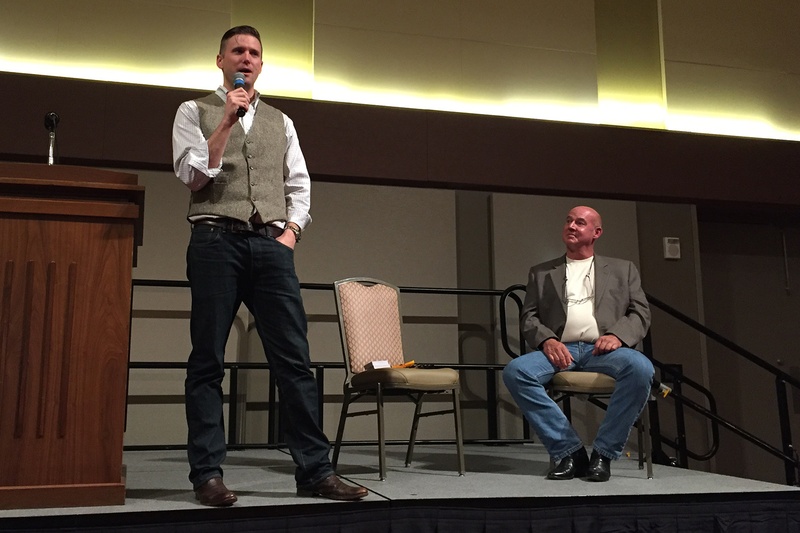 White nationalist Richard Spencer speaks at Texas A&M University in College Station while Preston Wiginton, who privately arranged the event, listens, on December 6, 2016.
