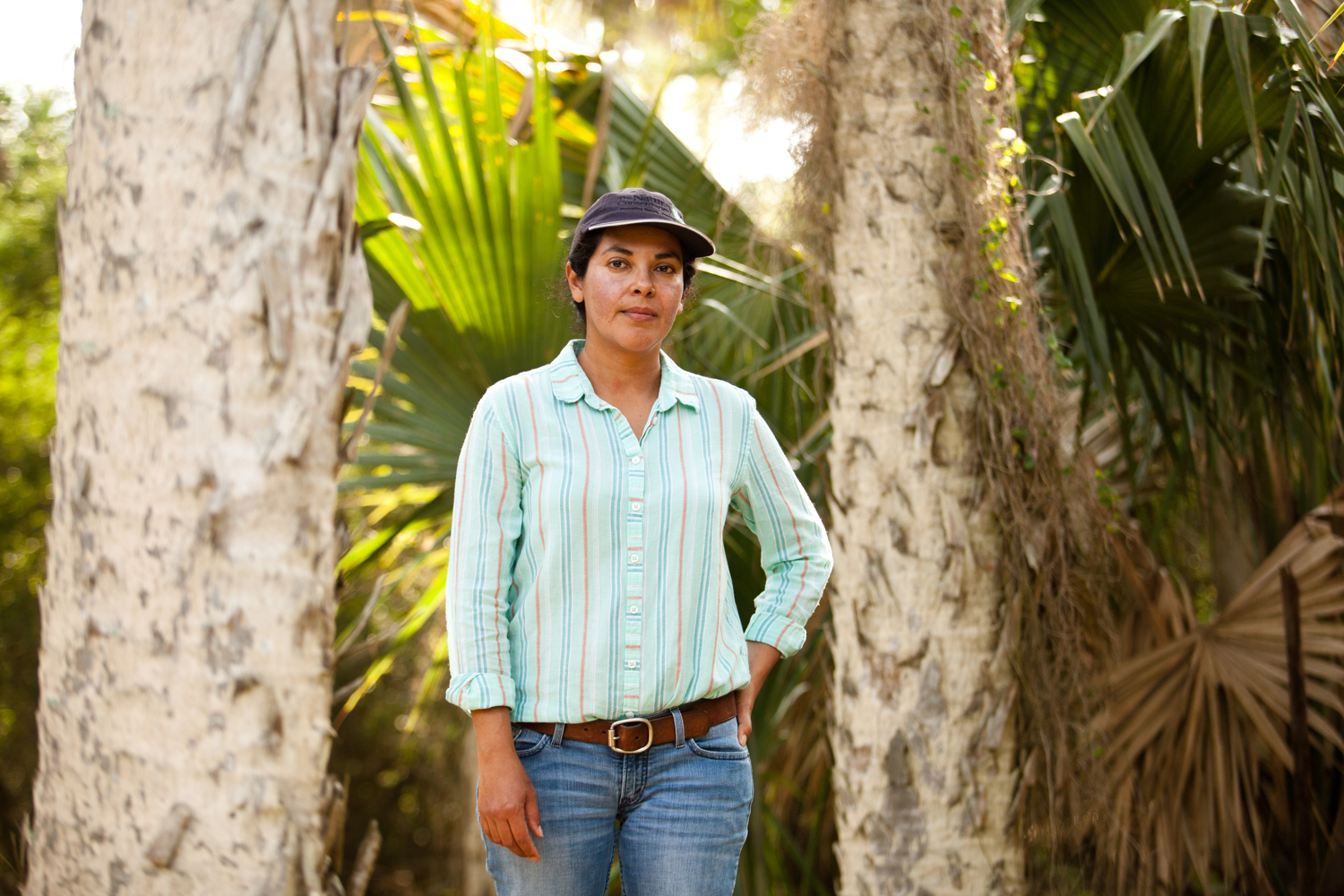 Sonia Najera, grassland manager for the Nature Conservancy, stands in sabal palm forest at the Lennox Foundation Southmost Preserve. The 1,100-acre preserve is home to some of the land remaining patches of sabal palm forest in the United States.It is prime habitat for the endangered ocelot, a small cat that looks like a tiny leopard.