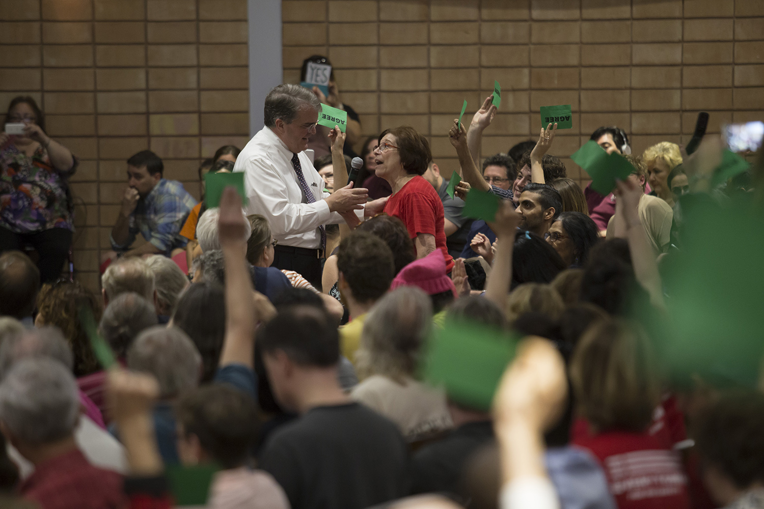 Debra Kerner, who says she has filed to run against him for his seat, challenges U.S. Rep. John Culberson, R-Houston, during a town hall in Houston on March 25, 2017. 