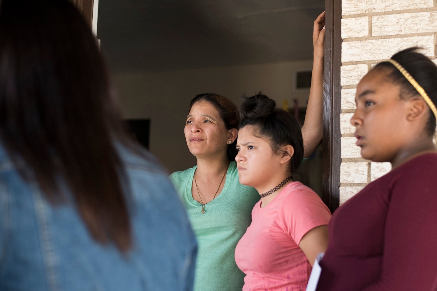 Rosa Ortega with her children outside their apartment in Grand Prairie.
