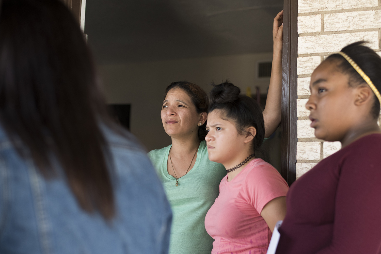 Rosa Ortega with her children outside their apartment in Grand Prairie.