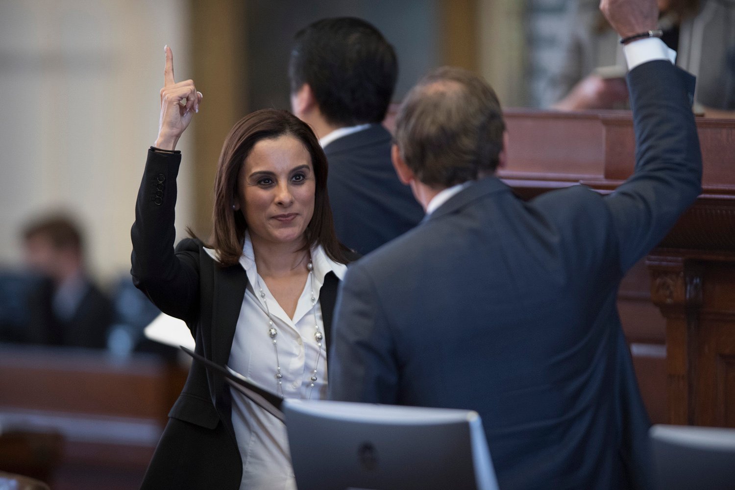 State Rep. Ina Minjarez, D-San Antonio votes in favor of her amendment to gut funding to the attorney general's office to fund programs that serve vulnerable children. It passed, 82 to 61.