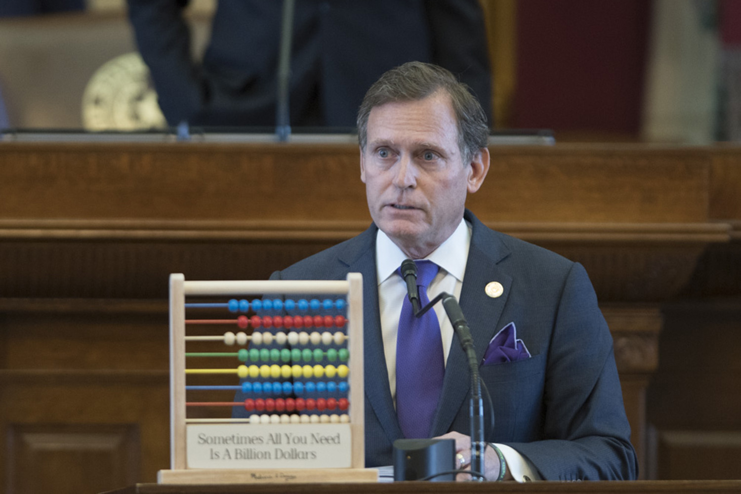 State Rep. John Zerwas, R-Richmond, who is chairman of the House Appropriations Committee, lays out the budget with an abacus as a prop. The plaque reads, 