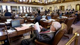 State Rep. Charlie Geren, R-Fort Worth, works from his desk on the House floor during debate on the House budget on April 6, 2017.