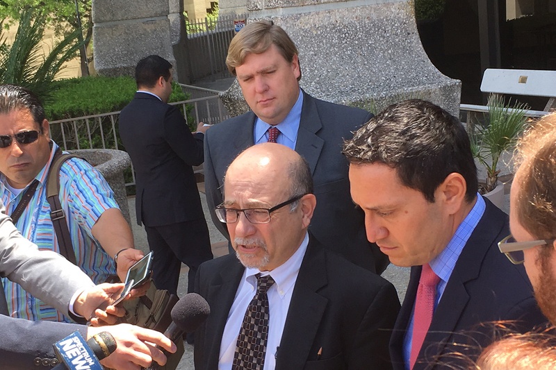 Jose Garza, an attorney for the Mexican American Legislative Caucus, and former Texas Rep. Trey Martinez Fischer speak to reporters on April 27, 2017, following a status conference on a years-long challenge to Texas' political maps.&nbsp;