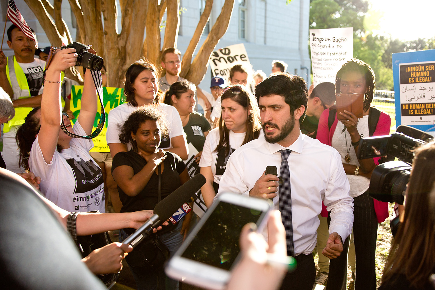 Austin City Council member Gregorio Casar speaks to opponents of the 