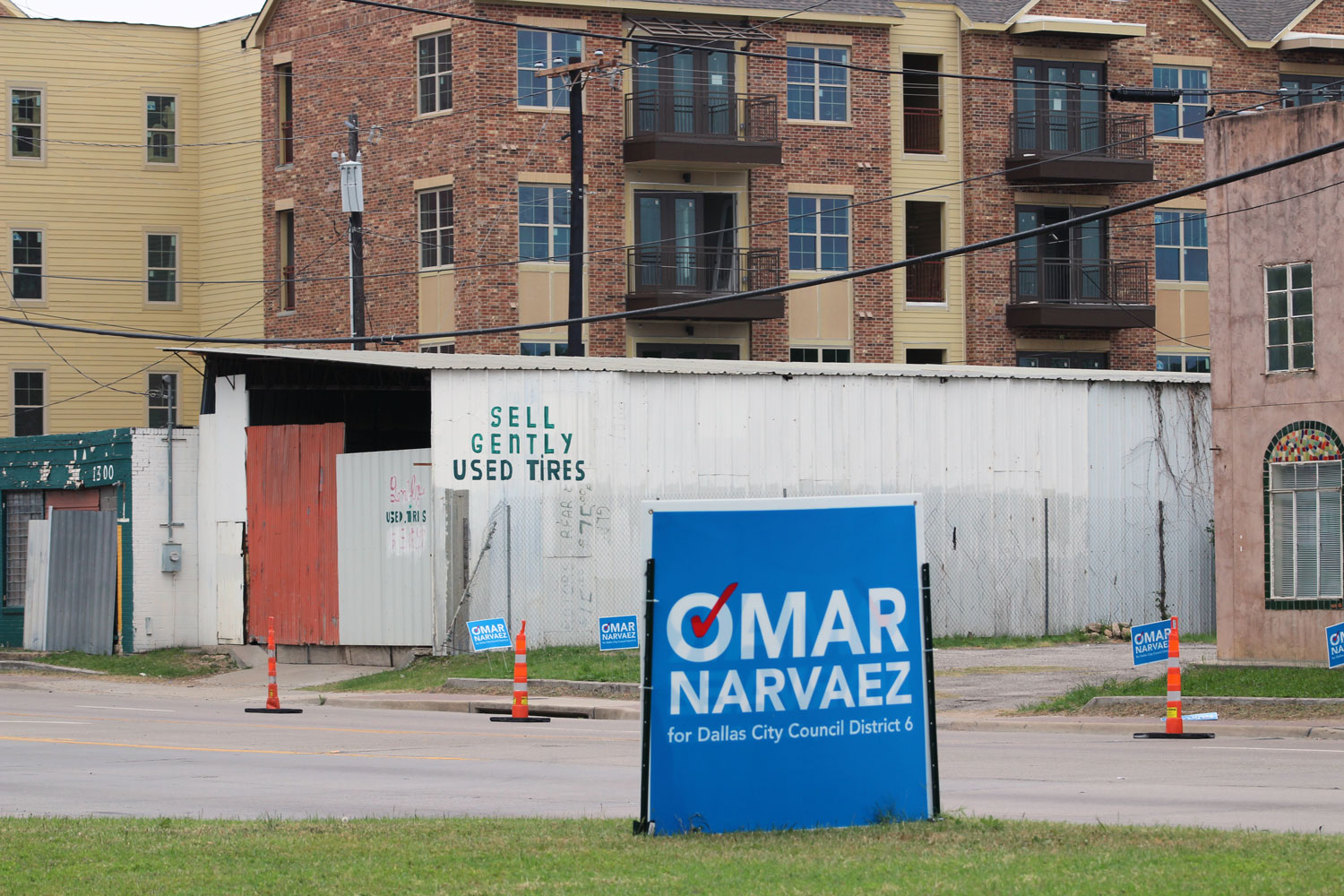 A campaign sign for Dallas City Council candidate Omar Narvaez sits along Singleton Boulevard in West Dallas. Narvaez is facing incumbent Monica Alonzo in a runoff next month in a part of the city where officials suspect mail-in voter fraud may have occurred. 