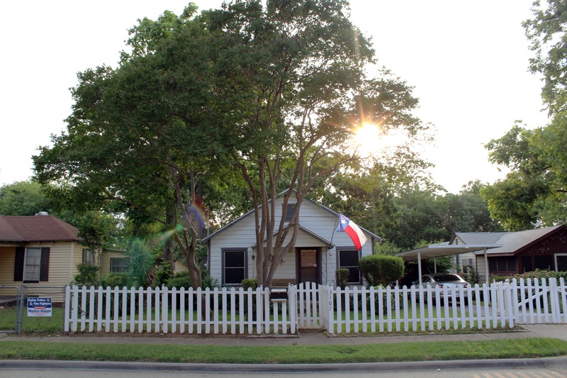 A home in West Dallas sits just a few blocks from where new developments are being built. The new construction is driving up the cost and property taxes of nearby homes. A new report from Harvard University says Americans in cities across the U.S. are having a harder time finding affordable places to rent or buy. 
