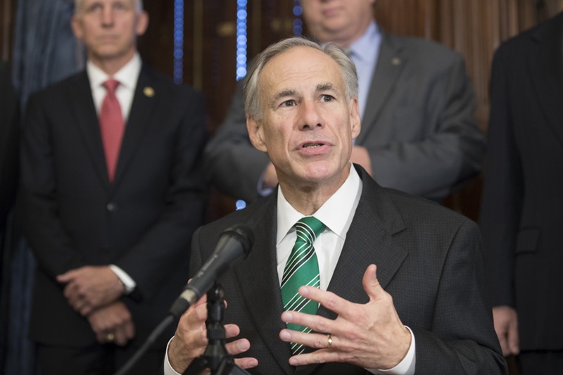 Gov. Greg Abbott signs a bill that cracks down on inappropriate student-teacher relationships on May 25, 2017.