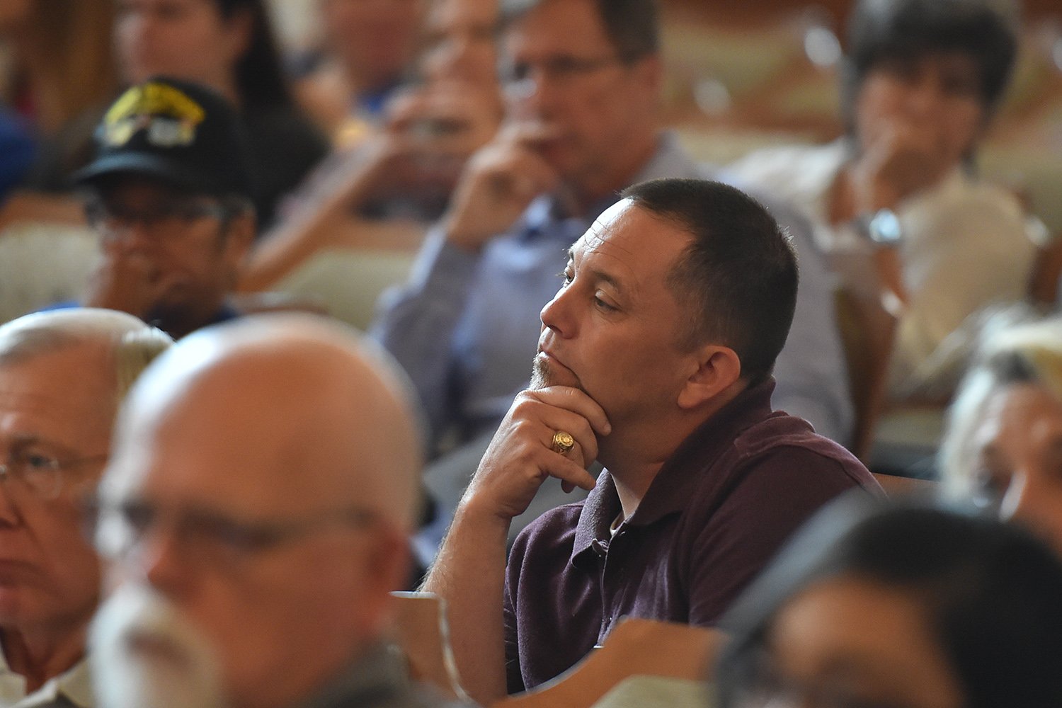 Local activist Mike Stewart listens during a Texas House Committee on Defense and Veterans' Affairs hearing on how annexation reform might affect nearby San Antonio military bases. The hearing was held in the San Antonio City Council chambers on June 19, 2017.