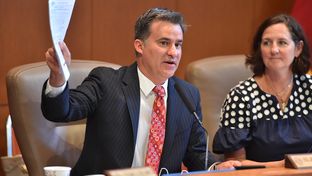 State Rep. Roland Gutierrez, D-San Antonio, the chairman of the Texas House Defense and Veterans' Affairs Committee, leads a June 19, 2017, hearing in San Antonio on how annexation reform affects area military bases. Next to Gutierrez is committee clerk Margaret Wallace. 