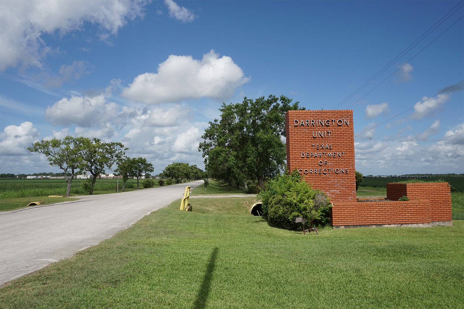 The Darrington prison sits among farmland at the end of a long, tree-lined entrance.  