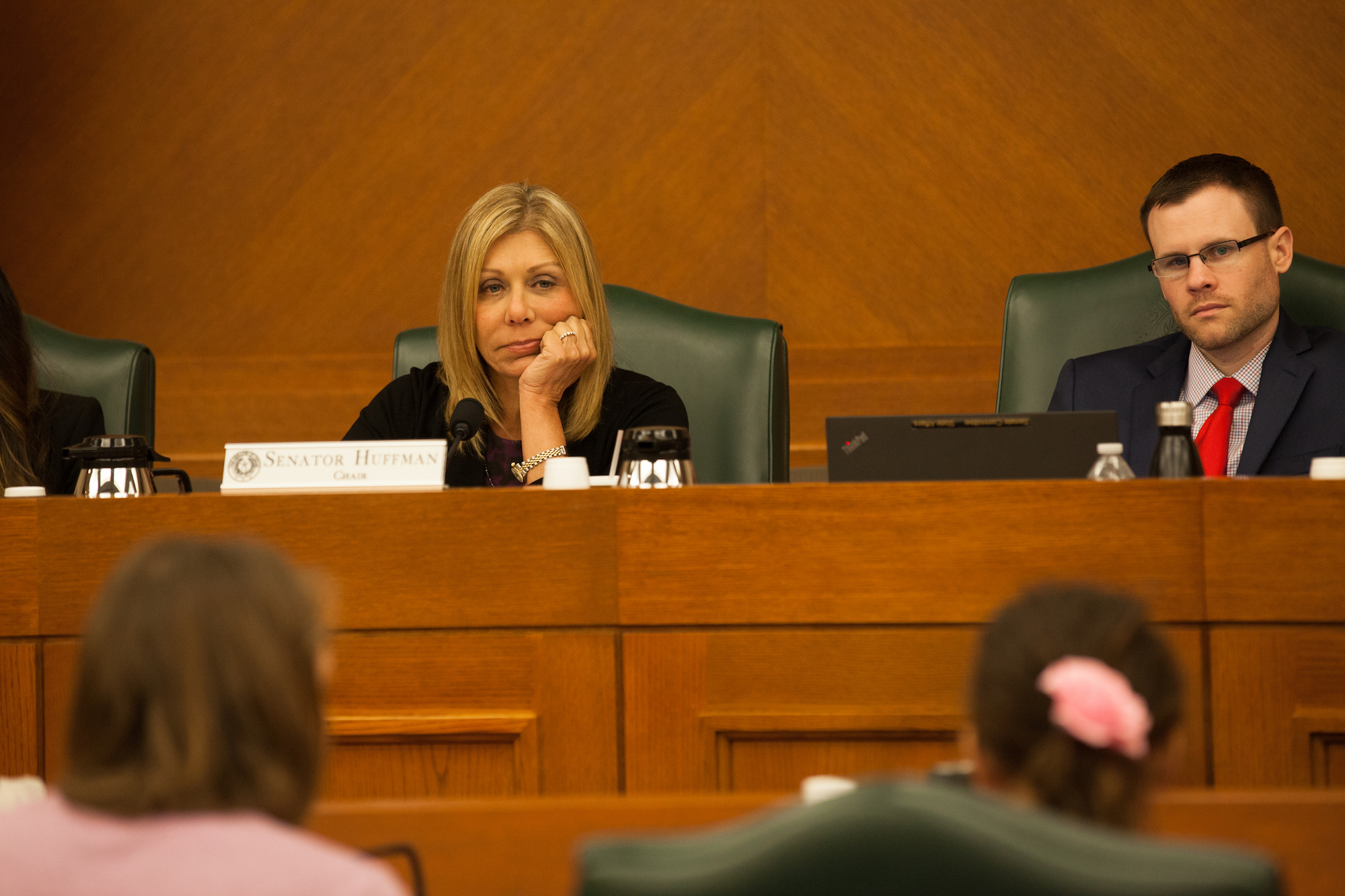 State Sen. Joan Huffman, R-Houston, listens to Libby Gonzales speak against SB 3 and SB 91 before the Senate State Affairs Committee on July 21, 2017.