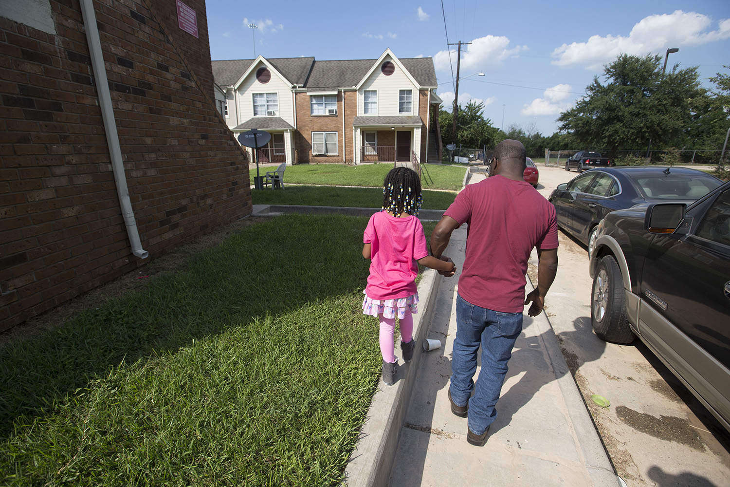 Eddie Rogers and his daughter Karla outside their Houston apartment on Thursday, Aug. 31, 2017.