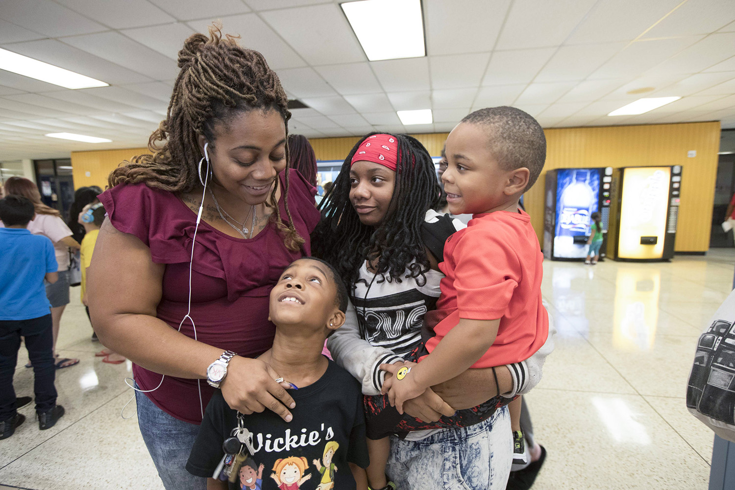 Opposed to Texas City ISD's relocation plan, Monique Lazard, at left, will re-enroll her 11-year-old daughter in a different school district.