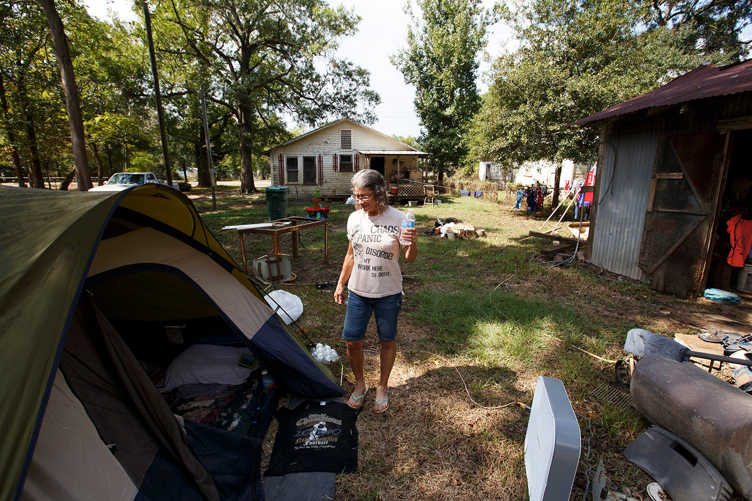 Carol Sue Smith is living in a tent behind her flood damaged house in Rose City, where there is still no working water system.