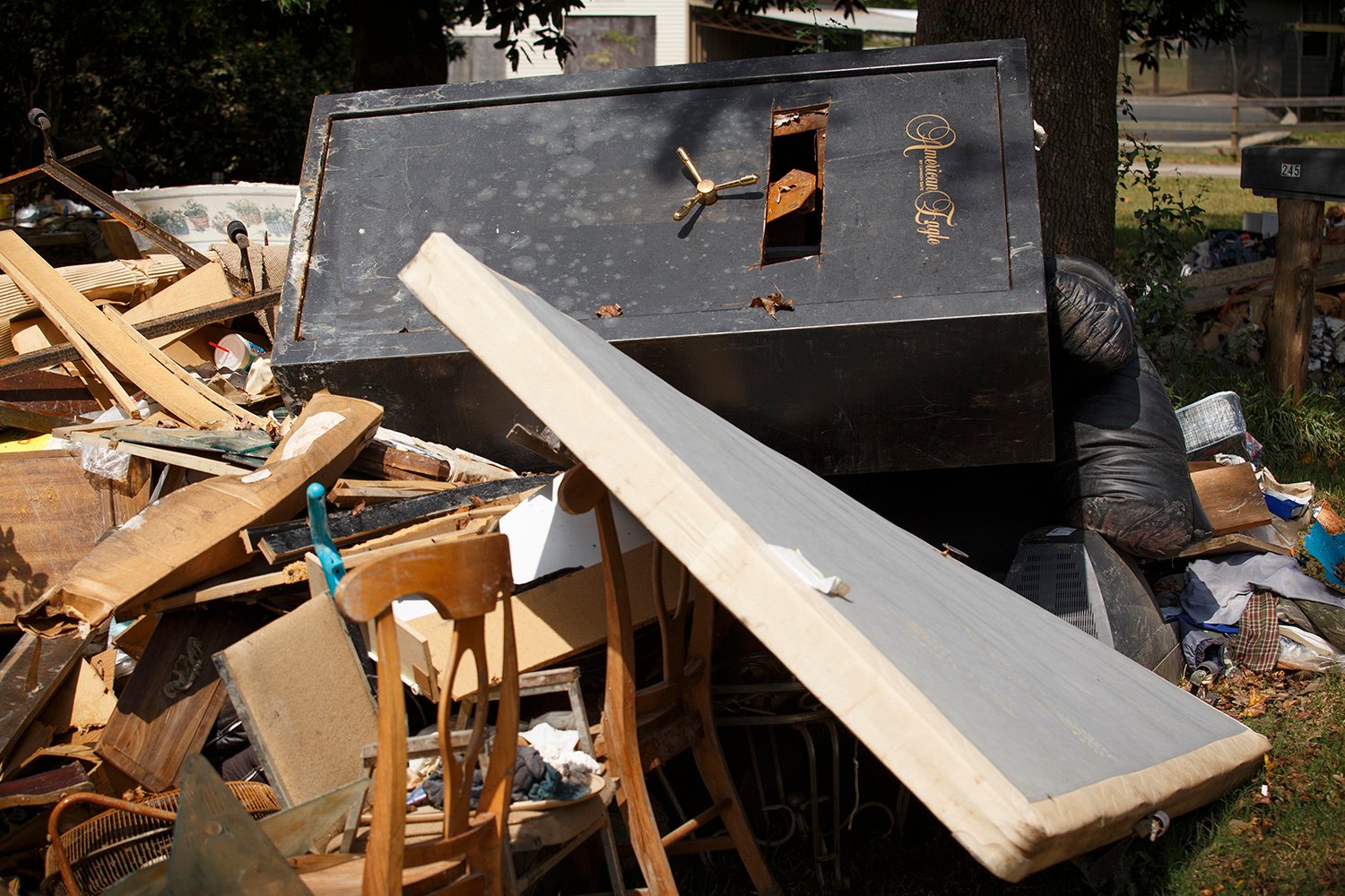 A discarded gun safe, with the lock cut open, in Rose City.