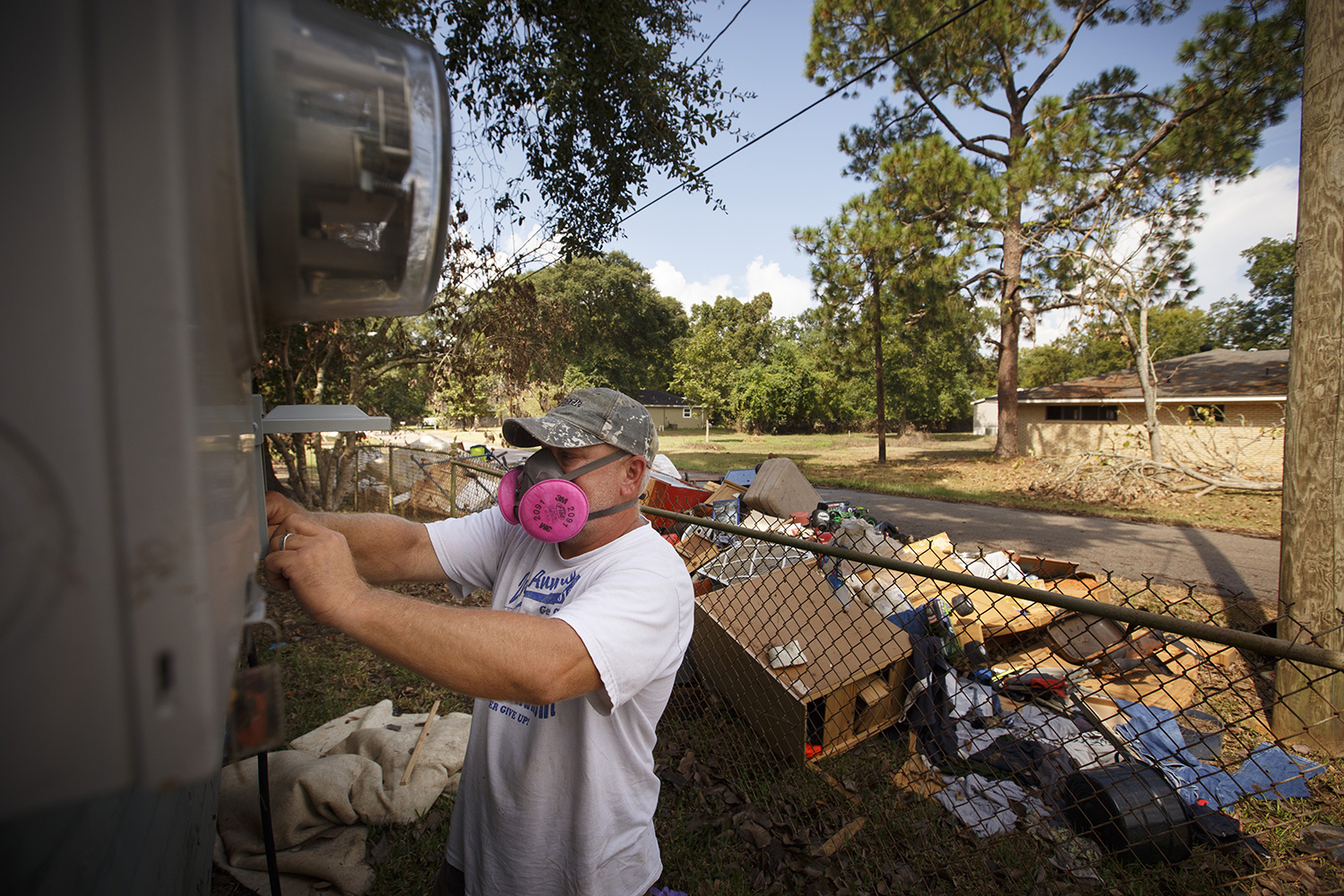 Clarke Godkin bought an RV to use at his hunting lease about two years ago. Now it’s become his semi-permanent home while he attempts to make repairs to his flood damaged house in Rose City. Here he is trying to connect the trailer to electricity. 